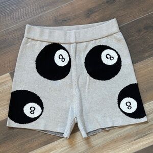 Dressed in LALA Black 8-Ball Shorts